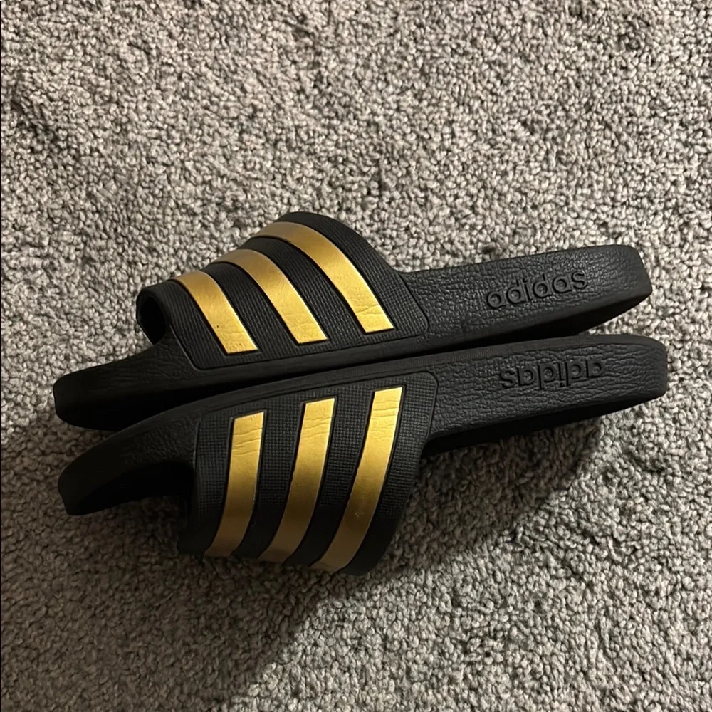 adidas Black Slide Sandals with Metallic Gold Stripes